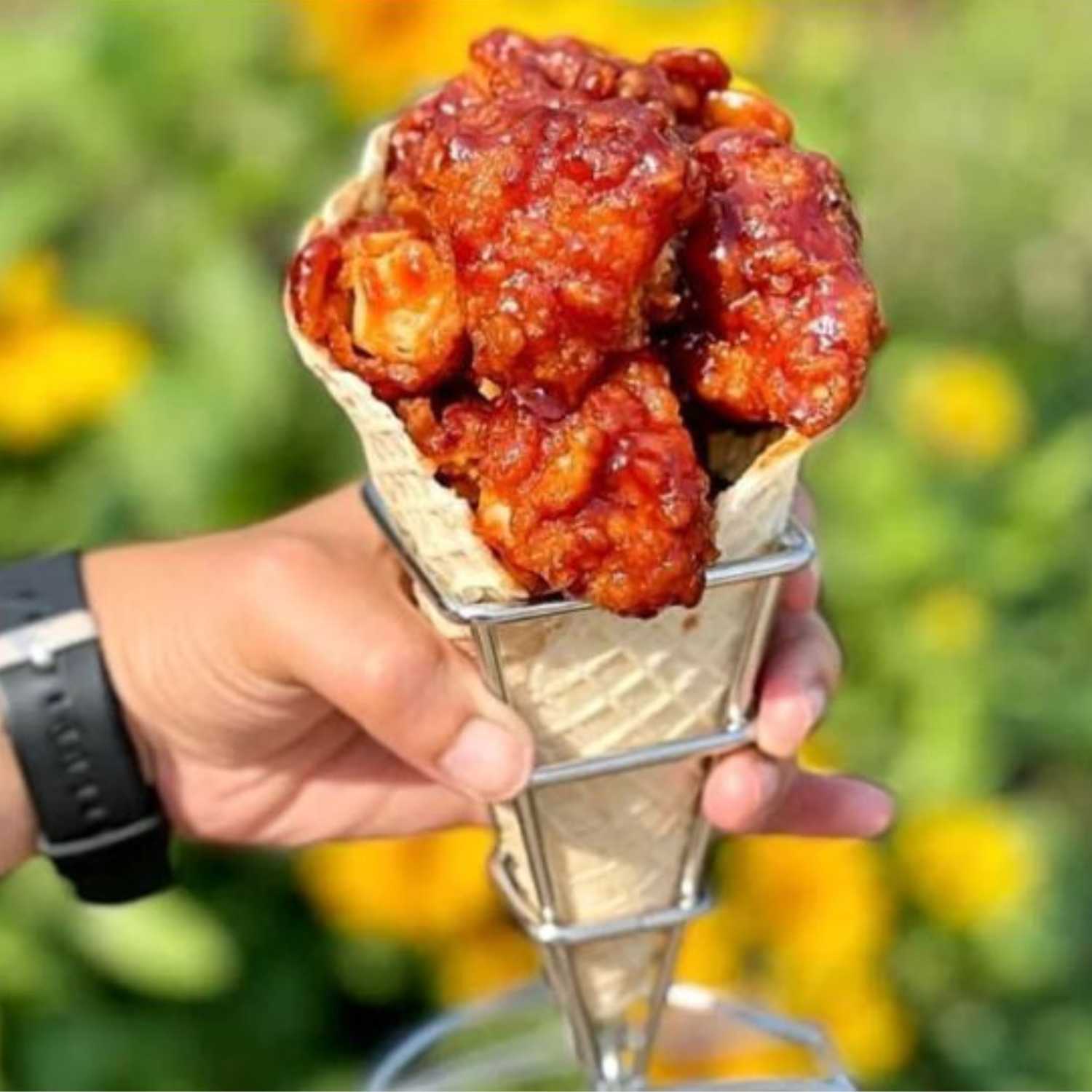 Hot Peri Peri Chicken Fingers in a waffle cone by Chick'n Cone!